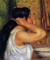 Mujer peinándose Pierre Auguste Renoir